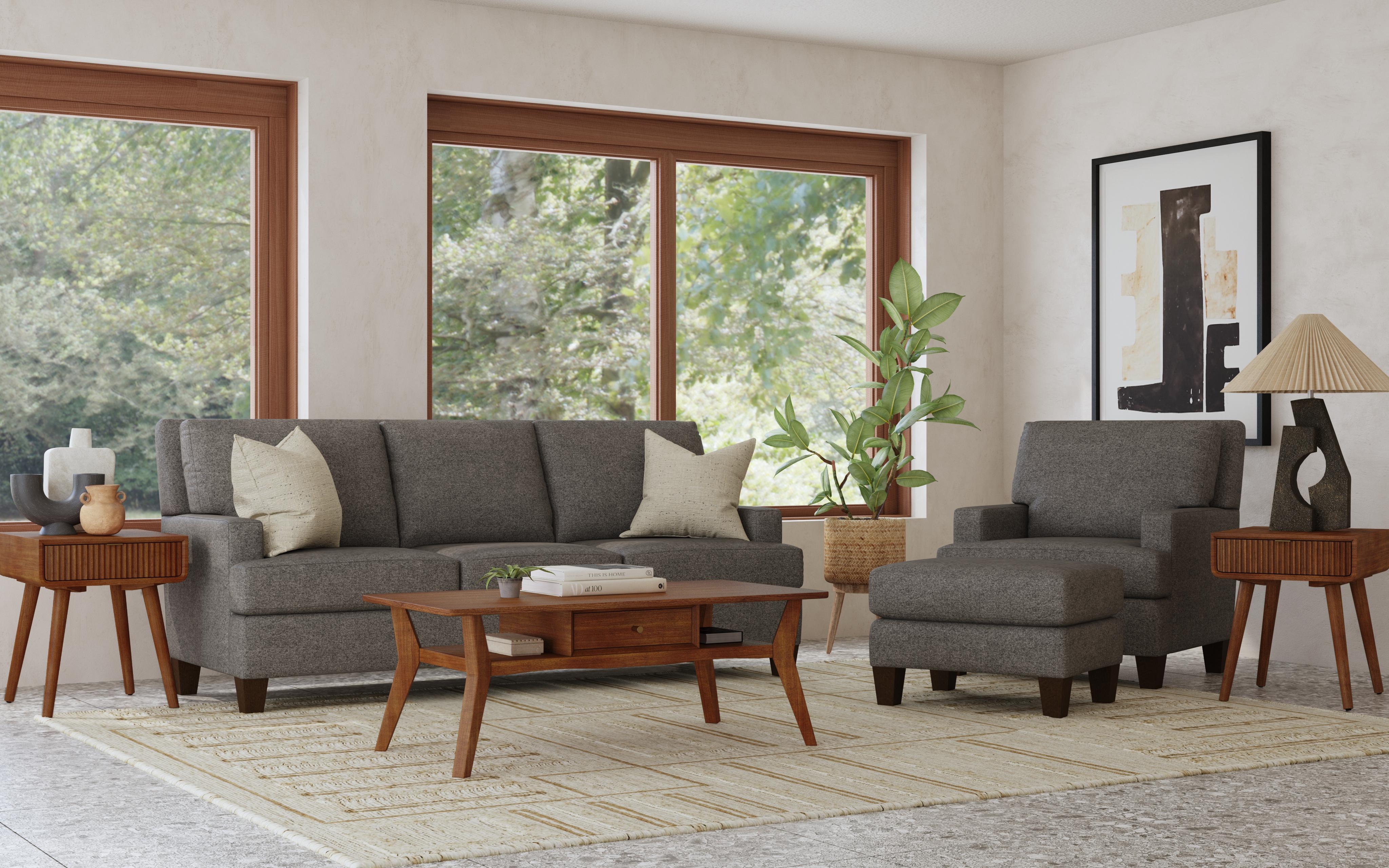 Coordinated gray sofa and armchair displayed in a bright, styled living room